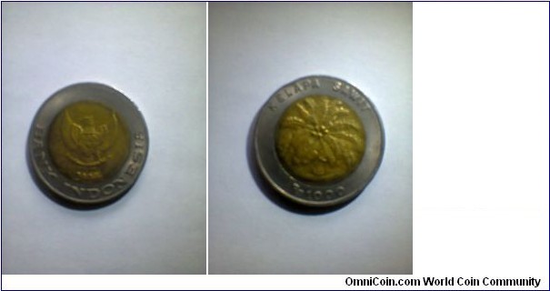 Coin 1000 rupiahs-Indonesia, palm oil. Bimetal : bronze and nickle