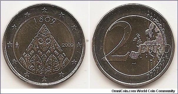 2 Euro
KM#149
8.5000 g., Bi-Metallic Nickel-Brass center in Copper-Nickel ring, 25.75 mm. Subject: 200th Anniversary of Finnish Autonomy. Obv: The inner part of the coin depicts the profile of the Porvoo Cathedral, which was the site of opening of the first Diet of Finland. The date 1809 appears on the top, and the year mark is on the right side. The indication of the issuing country FI and the mint mark are on the left side. The twelve stars of the European Union surround the design on the outer ring of the coin. Rev: 2 on the left-hand side, six straight lines run vertically between the lower and upper right-hand side of the face, 12 stars are superimposed on these lines, one just before the two ends of each line, superimposed on the mid - and upper section of these lines; the European continent ( extended ) is represented on the right-hand side of the face; the right-hand part of the representation is superimposed on the mid-section of the lines; the word ‘EURO’ is superimposed horizontally across the middle of the right-hand side of the face. Under the ‘O’ of EURO, the initials ‘LL’ of the engraver appear near the right-hand edge of the coin. Edge: Reeded with SUOMI FINLAND * * * (the * stands for a lion's head). Obv. designer: Reijo Juhani Paavilainen Rev. designer: Luc Luycx