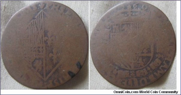 very worn thin copper coin, possibly dated 1560.