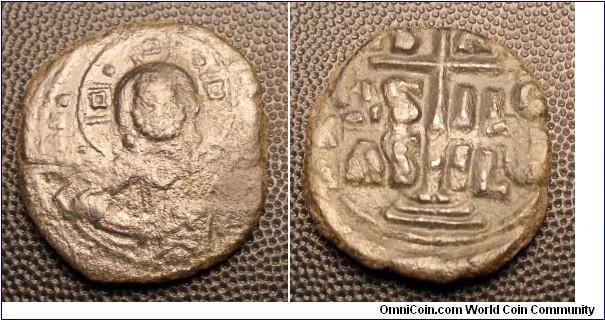 ANONYMOUS COINAGE 	 Æ Follis, Class B, Struck over class A2 follis-Obv. ΕΜΜΑΝΟΥΗΛ Bust of Christ facing. IC/XC in field. Rev. IhSuS / bASILEu / bASILE about cross on three steps. Struck over class A2 follis. 7.3gm, 28mm. BCV 1823 unknown date