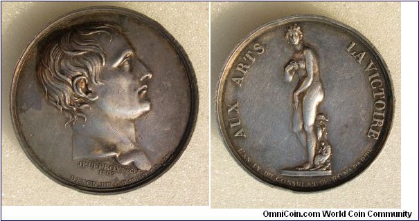 1803 Napoleon The Museum Visit La Venus de Medicis Medal by R.V. Jeuffroy. Silver 40MM.  
Obv: Bare-headed bust of Bonaparte I, right. Rev: AUX ARTS LA VICTOIRE, (The Arts Are The Winner) the marble sculpture of the Medici-Venus.
