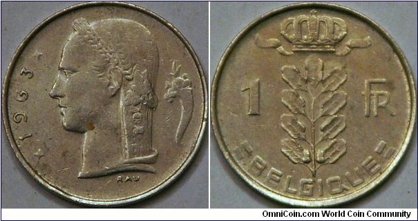 1 Franc, French wording, with Obverse of Laureated head or 'Head of Ceres' (http://en.numista.com) and a cornucopia. Reverse of a crown over a sprig or leaf. 21 mm, Cu-Ni. Found in change, same size as US 5 cent piece.