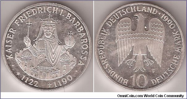 KM# 174 10 MARK
15.5000 g., 0.6250 Silver 0.3114 oz. ASW, 33 mm.   Subject: 
800th Anniversary - Death of Kaiser Friedrich Barbarossa
rev: Eagle above denomination Obv: Crowned figure with royal 
orb and scepter rising above castle walls, dates below