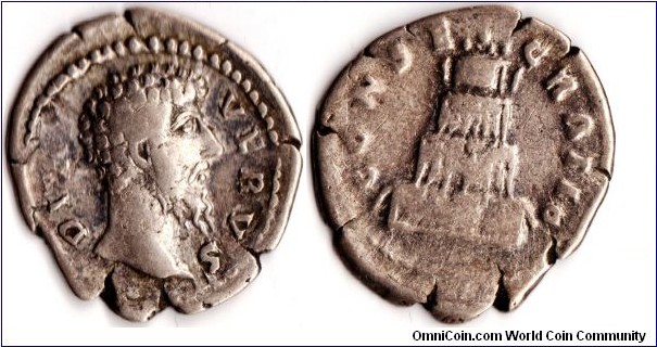 silver denarius of Lucius Verus, co-emperor with Marcus Aurelius. Obverse: bust of Lucius Verus with `Divus Verus' legend. reverse: four tier funeral pyre surmounted by a quadriga and the legend `Consecratio'