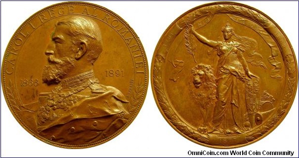 1891 Romania King Carol I Anniversary of 25 Year Reign Medal. Bronze 64MM./127.4 gm.
Obv: Bust of Charles I of Romania on the left, around 1866 to 1891. Rev: R/NIHIL - SINE DEO. Allegory helmet holding a palm & the crown of Romania, behind a lion at the bottom in 1877.
