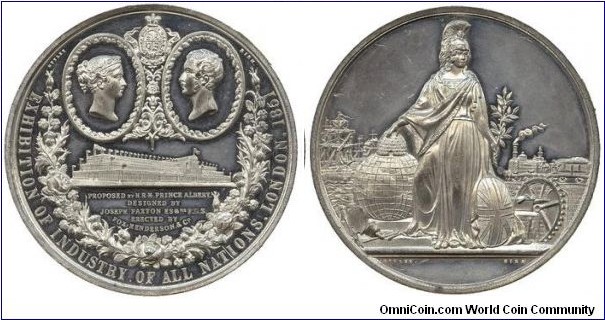 1851 UK Great Exhibition at Crystal Palace Medal strunk by T. Ottley of Birmingham. White Metal: 74MM.
Obv: Oval cameo portraits of Queen Victoria & Prince Albert, each in a vignette, facing each other, below, three-demensional perspective view of the Great Exhibition