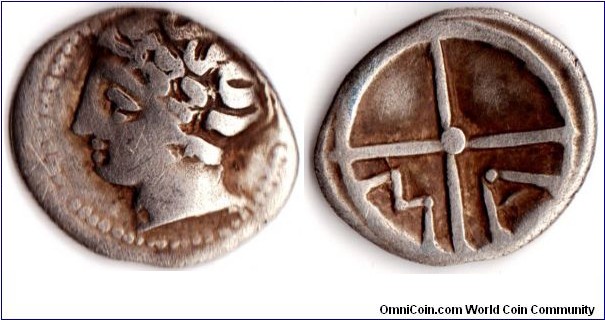silver obol circa 400bc from Massalia (marseille), a Phocean colony. Obverse  youthful male bust. Obverse MA in two quarters.