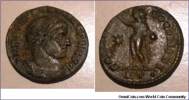 CONSTANTINE I
A.D. 307-337 	Æ Follis. Rev. SOLI INVICTO COMITI, Sol standing left raising right hand and holding globe, * in field, PT· in exergue, mint of Ticinum. 2.9gm 18mm RIC 16