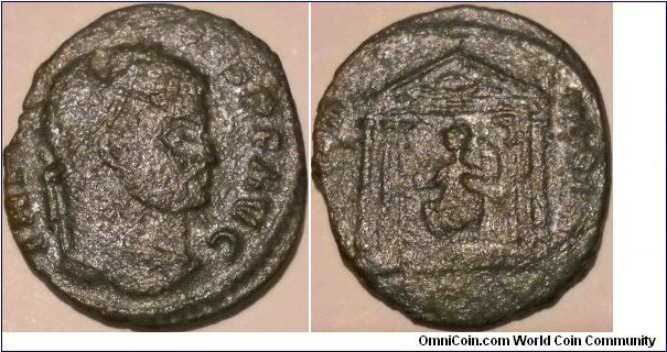 Maxentius AE Follis. 308-310 AD.RIC 210- IMP C MAXENTIVS PF AVG, laureate head right / CONSERV VRB SVAC, Roma seated left within hexastyle temple, holding globe & sceptre, a shield to her right & rear