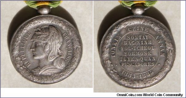 Bust representing the Republic of France facing left.  The headset is garnished with wings and feathers and Patrie (Motherland) is written across the front.  The style of this piece definitely was influenced by the realistic Roman portraiture.  The reverse read Tonkin Chine Annam 1883-1885 referencing the Franco-Sino War fought over the northern portion of modern Viet-Nam.  This medal was issued to about 90,000 veteran of the overall conflict.  Silver 30mm.