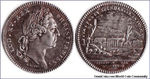 rare jeton struck in 1766 to commemorate the siting of a Royal refinery (silver and gold refining) at Trevoux in the Principality of Dombes. The jeton bears the mature bust of Louis XV obverse. The reverse shows a scene at Trevoux including the city wall (left) and the refinery (centre mid distance). 