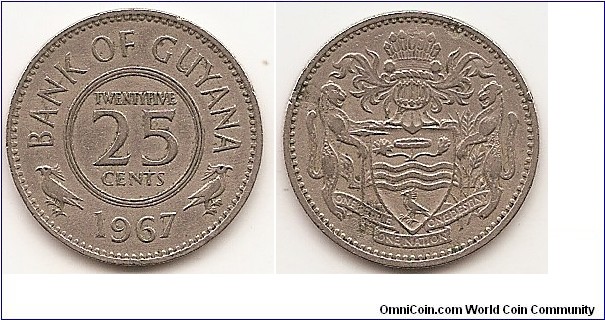 25 Cents
KM#34
4.2900 g., Copper-Nickel, 20.42 mm. Obv: Denomination within circle Rev: Helmeted and supported arms Edge: Reeded