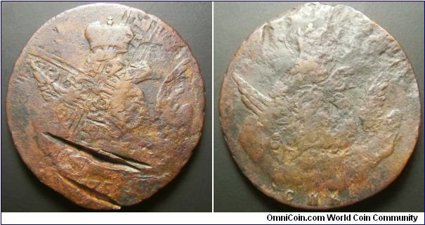 Russia 1755 (56?) 1 kopek SPB. Deep gorge and bent. Overstruck on 1727 5 kopek. Weight: 20.65g. 