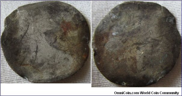 a complety worn flat happened coin.