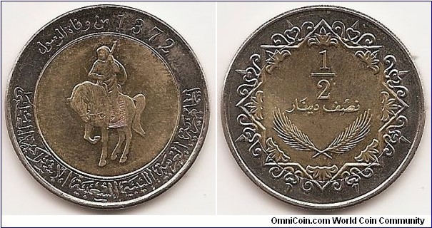 1/2 Dinar -MD1372-
KM#27
11.5000 g., Bi-Metallic Aluminumn bronze center in Copper-Nickel ring., 30 mm. Obv: Man on horse with gun 1/2 left, ornamental legend with date Rev: Value in Arabic script above wheat ears in ornamented frame Edge: Reeded