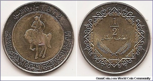 1/2 Dinar -MD1372-
KM#27
11.5000 g., Bi-Metallic Aluminumn bronze center in Copper-Nickel ring., 30 mm. Obv: Man on horse with gun 1/2 left, ornamental legend with date Rev: Value in Arabic script above wheat ears in ornamented frame Edge: Reeded