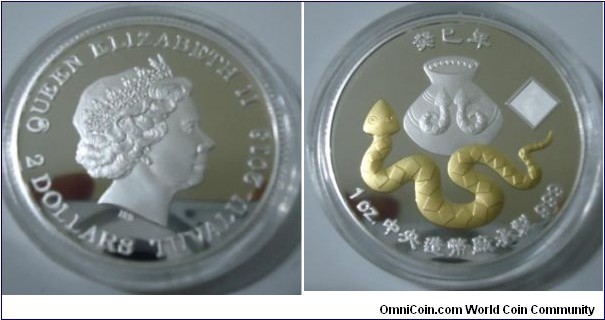 2013 Tuvalu QEII 2 Dollars Lunar Year of The Snake Proof Silver Coin Gilded Edition. 38MM/1 oz. Mintage 47,500 by Taiwan Central Bank.
Obv: The Portrait of Queen Elizabeth II left 2 Dollar Tuvalu 2013.  Rev: Gilded Hundred-Pace Snake rank as one of the Rare & Valuable Portected Species in Taiwan.  An Aboriginal Ceramin Pot in 2 Snakes design above. Rhombic latern image with Map of Taiwan & Mountain Yu. 

