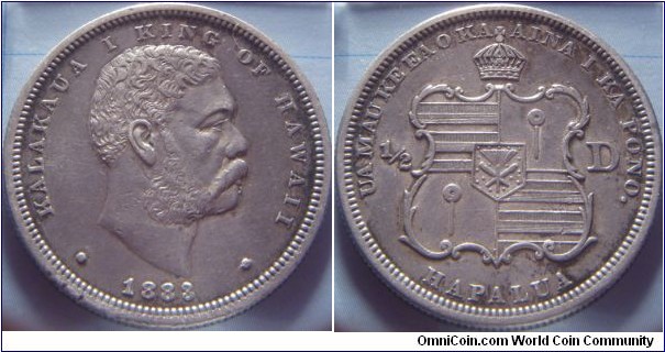 Hawaii | 
½ Dollar, 1883 | 
30 mm, 12.5 gr. | 
Silver (0.900) | 

Obverse: King Kalākaua facing right, date below | 
Lettering: • KALAKAUA I KING OF HAWAII • 1883 | 

Reverse: Hawaiian Coat of Arms divide denomination | 
Lettering: UA MAU KE EA O KA AINA I KA PONO. ½ D HAPALUA |