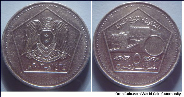 Syria | 
5 Pounds, 2003 | 
24.5 mm, 7.53 gr. | 
Nickel clad Steel | 

Obverse: National Coat of Arms, date below | 
Lettering: الجمهورية العربية السورية ٥ خمس ليرات سورية | 

Reverse: Citadel of Aleppo, denomination below | 
Lettering:  ١٤٢٤ھ - ٢٠٠٣م |