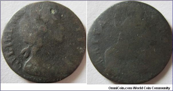 1698 or 99 halfpenny, worn, and date almost of the edge doesnt help.