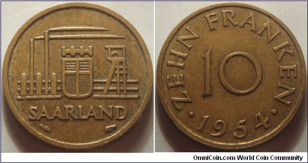 Saarland | 
10 Franken, 1954 | 
20 mm, 3.03 gr. | 
Aluminium-bronze | 

Obverse: Industrial scene, Coat of Arms in centre | 
Legend: SAARLAND | 

Reverse: Denomination in centre, date below | 
Legend: • ZEHN FRANKEN • 1954 | 