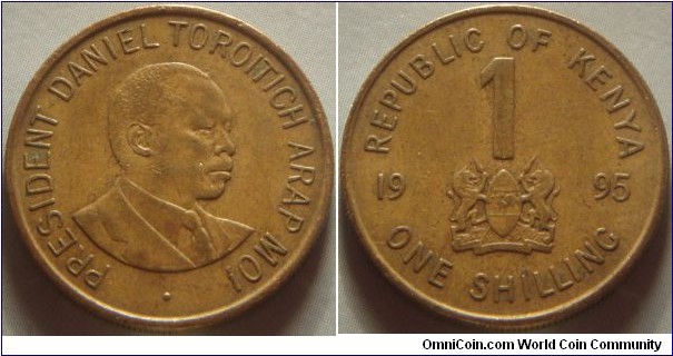 Kenya | 
1 Shilling, 1995 | 
22 mm, 4.35 gr. | 
Brass plated Steel | 

Obverse: Daniel arap Moi facing right | 
Lettering:: • PRESIDENT DANIEL TOROITICH ARAP MOI | 

Reverse: National Coat of Arms divide date, denomination above | 
Lettering:: REPUBLIC OF KENYA 1 19 ONE SHILLING 95 |