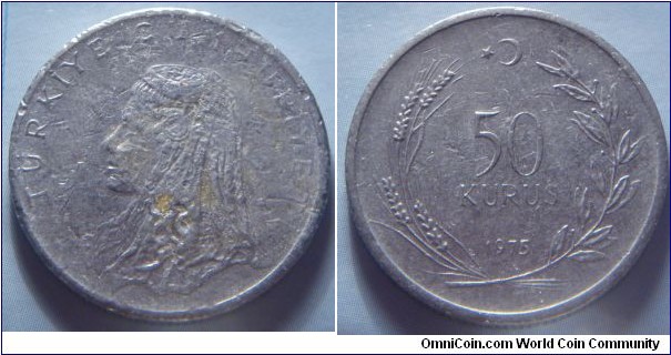 Turkey | 
50 Kuruş, 1975 | 
25 mm, 6.1 gr. |
Stainless Steel | 

Obverse: Anatolic bride's head facing left | 
Lettering: TÜRKİYE CUMHURİYETİ | 

Reverse: Denomination within wreath, star and crescent moon above, date below | 
Lettering: 50 KURUŞ 1975 |