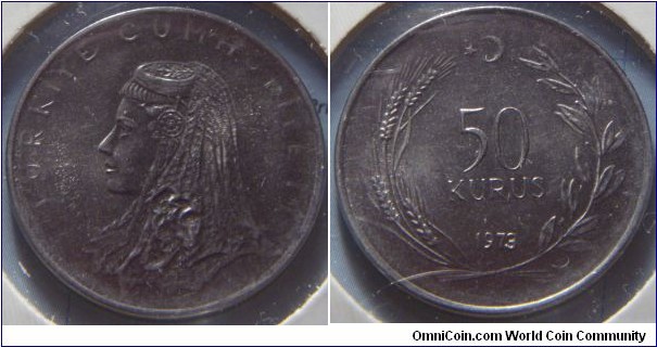 Turkey | 
50 Kuruş, 1973 | 
25 mm, 6.1 gr. |
Stainless Steel | 

Obverse: Anatolic bride's head facing left | 
Lettering: TÜRKİYE CUMHURİYETİ | 

Reverse: Denomination within wreath, star and crescent moon above, date below | 
Lettering: 50 KURUŞ 1973 |