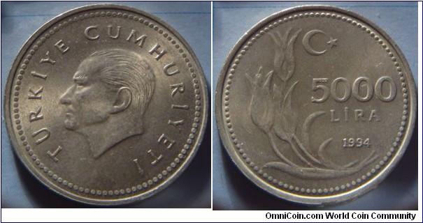 Turkey | 
5,000 Lira, 1994 | 
28.5 mm, 10.3 gr. | 
Nickel plated Brass | 

Obverse: Mustafa Kemal Atatürk facing left | 
Lettering: TÜRKİYE CUMHURİYETİ | 

Reverse: Flower sprigs left, crescent moon and star above, denomination centre and date below | 
Lettering: 5000 LİRA 1994 |