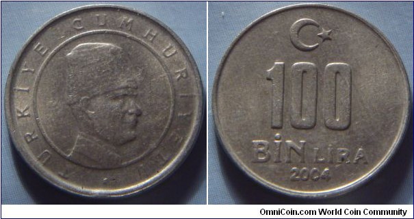 Turkey | 
100,000 Lira, 2004 | 
21 mm, 4.6 gr. | 
Copper-nickel-zinc | 

Obverse: Head with hat facing right inside circle | 
Lettering: TÜRKİYE CUMHURİYETİ  | 

Reverse: Denomination in centre, crescent moon and star above, year below | 
Lettering: 100 BİN LİRA 2004 |