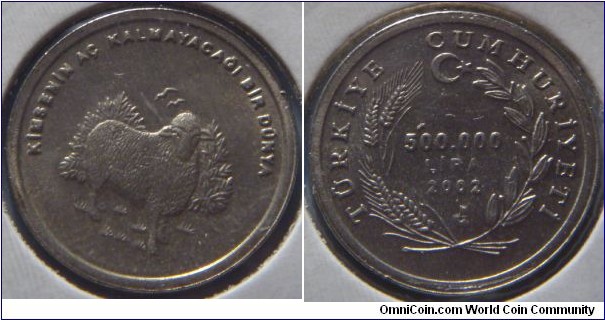 Turkey | 
500,000 Lira, 2002 | 
21 mm, 4.6 gr. | 
Copper-nickel | 

Obverse: A sheep, legend above | 
Lettering: KİMSENİN AÇ KALMAYACAĞI BİR DÜNYA | 

Reverse: Denomination in centre, crescent and moon above and date below within springs, legend on top | 
Lettering: TÜRKİYE CUMHURİYETİ 500.000 LİRA 2002 |