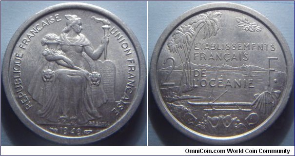 French Oceania | 
2 Francs, 1949 | 
27 mm, 2.19 gr. | 
Aluminium | 

Obverse: Seated Liberty with torch and cornucopia, date below | 
Lettering: REPUBLIQUE FRANÇAISE  UNION FRANÇAISE 1949 | 

Reverse: Island scene divide denomination | 
Lettering: ETABLISSEMENTS FRANÇAIS DE L’OCÉANIE 2 F. |