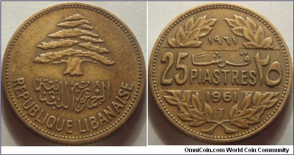 Lebanon | 
25 Piastres, 1961 | 
23.3 mm, 3.97 gr. | 
Aluminium-bronze | 

Obverse: A cedar tree – the symbol of Lebanon  | 
Lettering: الجمهوريّة اللبنانيّة REPUBLIQUE LIBANAISE | 

Reverse: Denomination in Arabic and Latin numbers, date above in Arabic numerals and Latin numerals below | 
Lettering: ١٩٦١ 25 قرش PIASTRES ٢٥ 1961 |