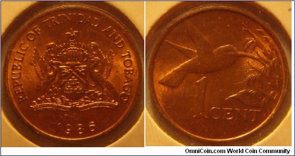 Trinidad & Tobago | 
1 Cent, 1986 | 
17.8 mm, 1.95 gr. | 
Bronze | 

Obverse: National Coat of Arms, date below | 
Lettering:  REPUBLIC OF TRINDAD AND TOBAGO 1986 | 

Reverse: Hummingbird, denomination below | 
Lettering: 1 CENT |