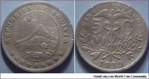 Bolivia | 
5 Centavos, 1919 | 
20 mm, 2.5 gr. | 
Copper-nickel |

Obverse: National Coat of Arms | 
Lettering: REPUBLICA DE BOLIVIA ********* | 

Reverse: Caduceus above sprays divides denomination, date below | 
Lettering: CINCO CENTAVOS 5 C 1919 |