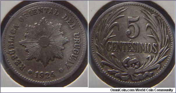Uruguay | 
5 Centésimos, 1924 | 
23.3 mm, 5 gr. | 
Copper-nickel | 

Obverse: Sun with rays, date below | 
Lettering: * REPÚBLICA ORIENTAL DEL URUGUAY * 1924 | 

Reverse: Denomination within laurel wreath | 
Lettering: 5 CENTÉSIMOS |