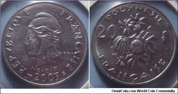 French Polynesia | 
20 Francs, 2003| 
28.3 mm, 10 gr. | 
Nickel | 

Obverse: Marianne facing left, date below | 
Lettering: REPUBLIQUE FRANÇAISE I•E • O•M• 2003 | 

Reverse: Berry bush devides denomination| 
Lettering: POLYNESIE FRANÇAISE 20 f |