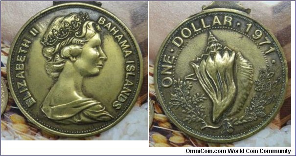 1971 Bahama Islands Elizabeth II medal. Bronze: 45MM
Obv: Bust of Elizabeth II faced right. Legend ELIZABETH II BAHAMA ISLANDS. Rev: Wreath on both side with Conch  in centre. Legend ONE DOLLAR 1971.
