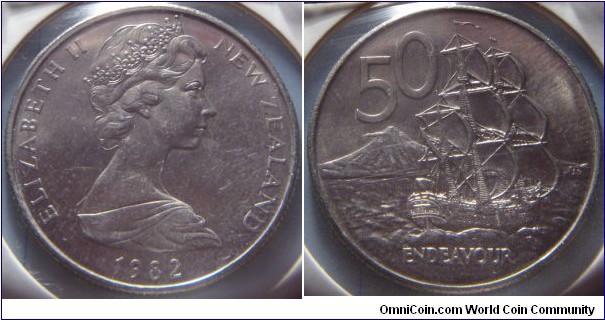 New Zealand |
50 Cents, 1982 |
31.75 mm, 13.61 gr. |
Copper-nickel |

Obverse: Queen Elizabeth II facing right, date below |
Lettering: ELIZABETH II NEW ZEALAND 1982 |

Reverse: Endeavour, denomination above |
Lettering: 50 |
