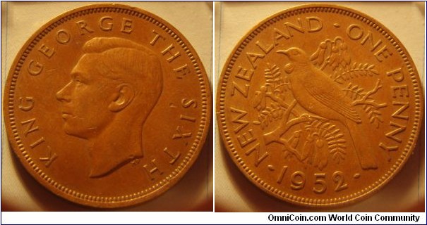 New Zealand |
1 Penny, 1952 |
31 mm, 9 gr. |
Bronze |

Obverse: King George VI facing left |
Lettering: KING GEROGE THE SIXTH |

Reverse: A Tui bird on branch facing left, denomination right, date below |
Lettering: • NEW ZEALAND • ONE PENNY • 1952 |