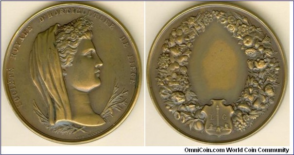 1861 Belgium Horticultural Society of Liege Medal by Leopold Wiener. Bronze: 48.05MM./1.633 oz.
Obv: Veiled beauty facing left with wreath & LEOP WEINER under. Legend SOCIETE ROYALE D'HORTICULTURE DE BEIGE. Rev: Wreath of horticultural fruits & floras around. Coat of Arm of Liege in centre below.
