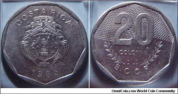 Costa Rica | 
20 Colones, 1985 | 
31.25 mm, 9.7 gr. |  
Stainless Steel | 

Obverse: National Coat of Arms, date below | 
Lettering: COSTA RICA 1985 | 

Reverse: Denomination in numbers and Braille above coffee branches| 
Lettering: 20 COLONES ⠃⠚ B.C.C.R. |