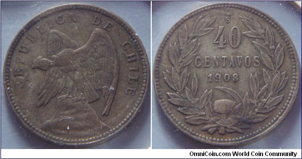Chile | 
40 Centavos, 1908 | 
25 mm, 6 gr. | 
Silver (.400) | 

Obverse: Andean Condor on rock facing left | 
Lettering: REPUBLICA DE CHILE | 

Reverse: Denomination within wreath, date below | 
Lettering: 40 CENTAVOS 1908 |