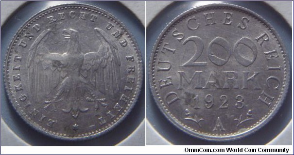 Weimar Republic | 
200 Mark, 1923 A | 
20 mm, 3.3 gr. | 
Bronze | 

Obverse: Heraldic eagle | 
Lettering: EINIGKEIT UND RECHT UND FREIHEIT * | 

Reverse: Denomination, date below, mint letter bottom | 
Lettering: DEUTSCHES REICH 200 MARK 1923 A |