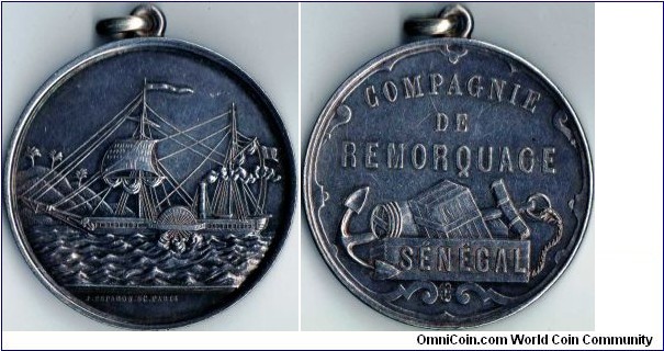 very scarce jeton minted for the `Compagnie de Remorquage du Senegal', a french owned tug/ maritime salvage company operating out of Dakar, Senegal. The jeton carries the `abeille' assay mark, confirming it as an original and struck sometime between 1860 and 1879 and issued to directors / shareholders of the company. There are later re-strikes with the cornucopia assay mark (after 1880). This example has a loop edge mounting, but is otherwise in an excellent collectable condition.