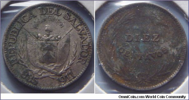 El Salvador | 
10 Centavos, 1911 | 
18 mm, 2.5 gr. | 
Silver (.835) | 

Obverse: National Coat of Arms, date below | 
Lettering: REPUBLICA DEL SALVADOR 15 SET DE 1821 835 1911 | 

Reverse: Denomination in wreath | 
Lettering: DIEZ CENTAVOS |