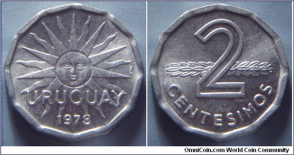 Uruguay | 
2 Centésimos, 1978 | 
21 mm, 1.6 gr. | 
Aluminium | 

Obverse: Sun with face, date below | 
Lettering: URUGUAY 1978 | 

Reverse: Denomination in front of supine stalk | 
Lettering: 2 CENTESIMOS |