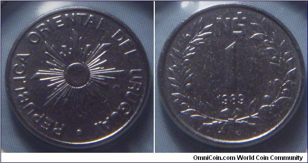Uruguay | 
1 Nuevo Peso, 1989 | 
12 mm, 0.9 gr. | 
Stainless Steel | 

Obverse: Sunburst | 
Lettering: • REPUBLICA ORIENTAL DEL URUGUAY | 

Reverse: Denomination, date below | 
Lettering: N$ 1 1989 |