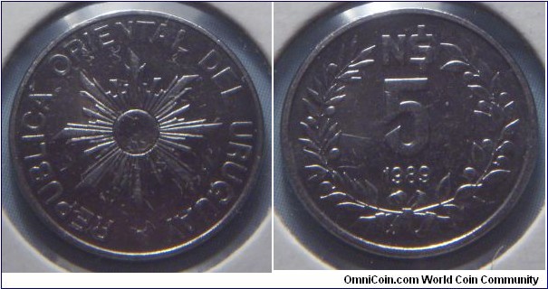 Uruguay | 
5 Nuevos Pesos, 1989 | 
15.5 mm, 1.5 gr. | 
Stainless Steel | 

Obverse: Sunburst | 
Lettering: • REPUBLICA ORIENTAL DEL URUGUAY | 

Reverse: Denomination, date below | 
Lettering: N$ 5 1989 |