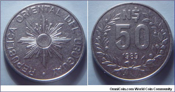 Uruguay | 
50 Nuevos Pesos, 1989 | 
23 mm, 4.8 gr. | 
Stainless Steel | 

Obverse: Sunburst | 
Lettering: • REPUBLICA ORIENTAL DEL URUGUAY | 

Reverse: Denomination within Laurel wreath, date below | 
Lettering: N$ 50 1989 |